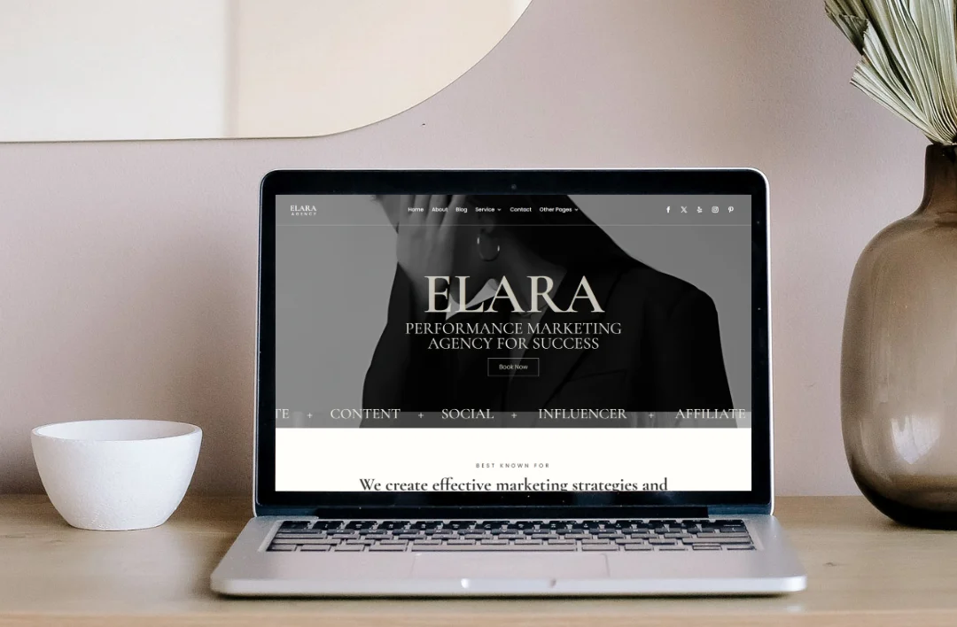 A promotional mockup for the Elara WordPress theme shown on a desktop monitor, tablet, and smartphone. The website features a premium monochrome design with the headline "ELARA: Performance Marketing Agency for Success." To the right, two black 5-star testimonial bubbles from James and Sarah highlight the theme's professional layout and ease of customization for marketing agencies and coaches.
