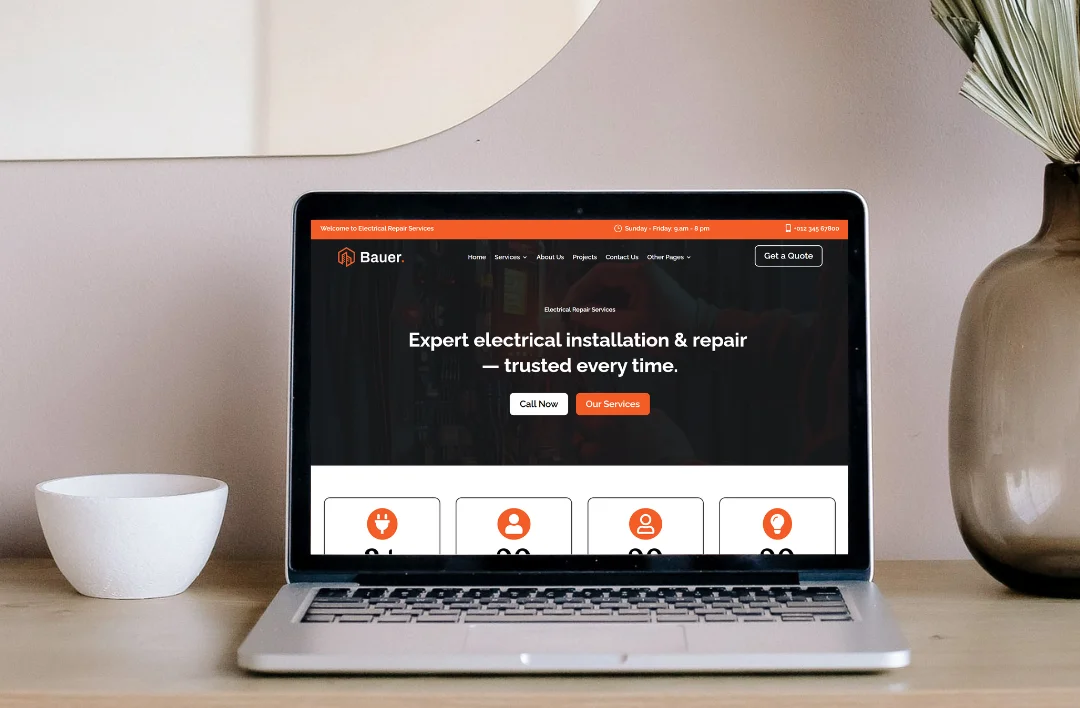 Electrician service website homepage displayed on a laptop screen featuring expert electrical installation and repair layout with service icons.