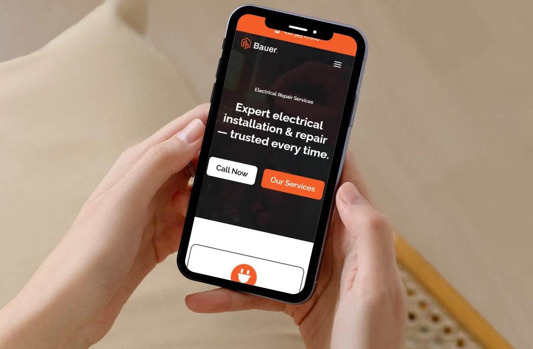 Mobile view of an electrician website showing electrical installation and repair headline with call-to-action buttons.