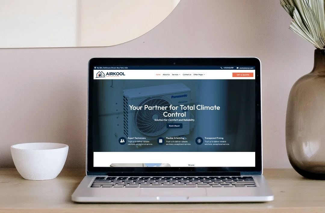 A high-end laptop on a wooden desk displaying an HVAC website using the Divi theme, featuring a 'Total Climate Control' hero banner and professional service navigation.