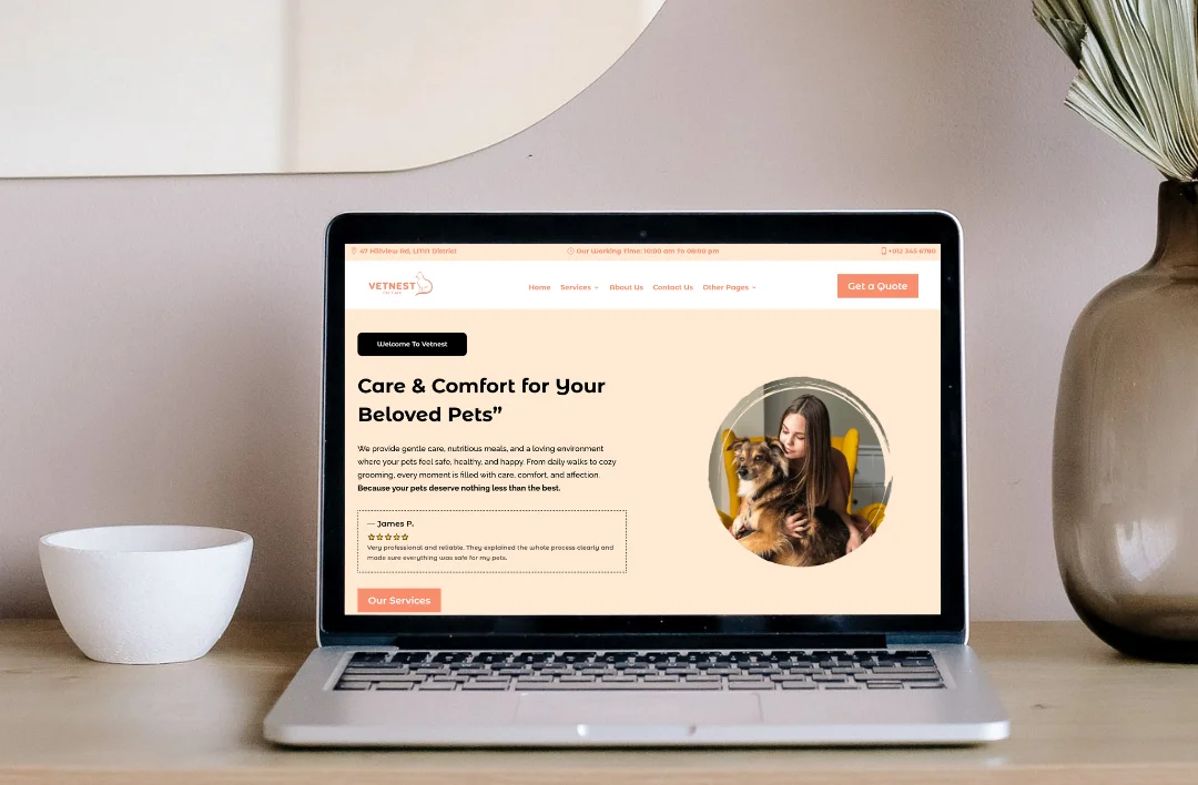 A desktop website mockup for 'Vetnest' pet care displayed on a laptop in a clean office setting. The website features a soft peach and cream theme with a circular hero image of a person with their dog. The headline reads 'Care & Comfort for Your Beloved Pets,' accompanied by a five-star customer testimonial and a prominent 'Get a Quote' button in the navigation bar.