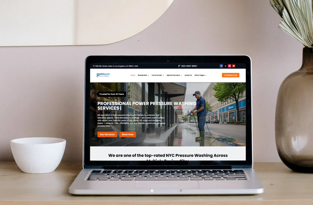 Pressure washing service website homepage displayed on a laptop screen featuring professional power washing layout and call-to-action section.