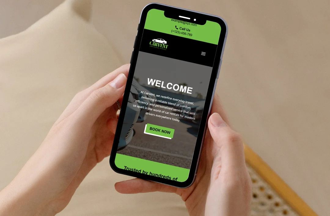 A person's hands holding a smartphone that displays the mobile-responsive website for 'CARVENT Car Rental Service'. The site features a lime green and black theme with a prominent 'WELCOME' message, a brief company description, and a bright green 'BOOK NOW' button. The top bar includes the company logo and contact information, illustrating a clean and modern user interface for mobile users.