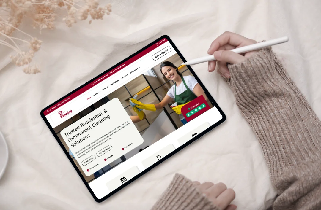 Tablet displaying a cleaning services WordPress website homepage with residential and commercial cleaning layout and call-to-action buttons.