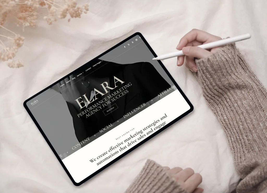 A promotional mockup for the Elara WordPress theme shown on a desktop monitor, tablet, and smartphone. The website features a premium monochrome design with the headline "ELARA: Performance Marketing Agency for Success." To the right, two black 5-star testimonial bubbles from James and Sarah highlight the theme's professional layout and ease of customization for marketing agencies and coaches.