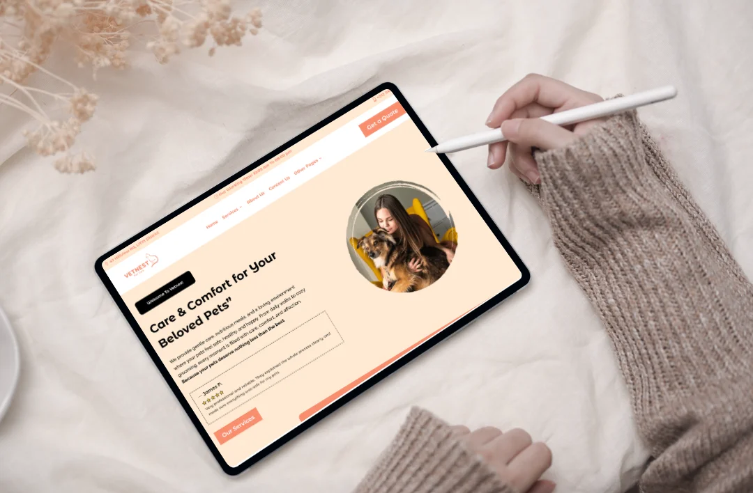 A lifestyle mockup of a 'Vetnest' pet care website template displayed on a tablet. The website features a soft peach and cream color scheme with a circular image of a woman and her dog. The headline reads 'Care & Comfort for Your Beloved Pets,' accompanied by a descriptive paragraph about high-quality animal care. The design includes a five-star testimonial from a customer named James P. and a prominent 'Get a Quote' button.